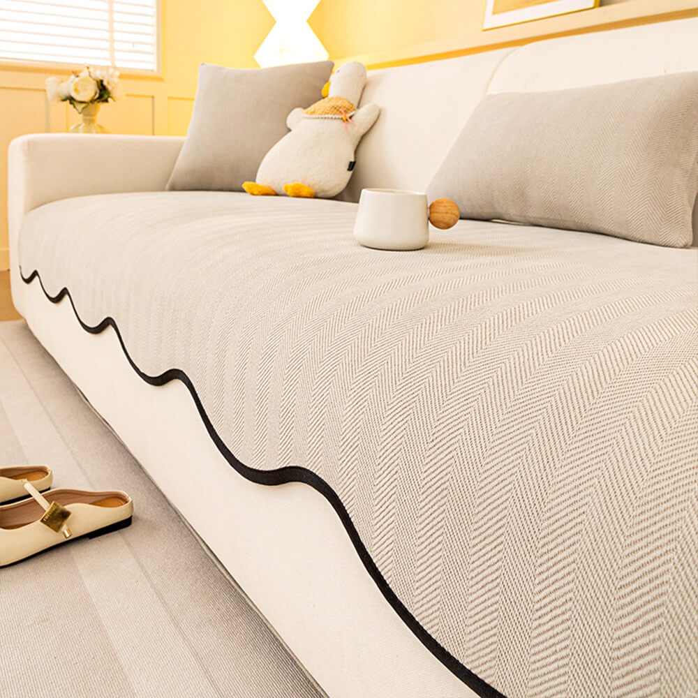 https://cdn.shopify.com/s/files/1/0549/1638/2879/files/FunnyFuzzyMinimalistHerringboneChenilleNon-SlipWavyEdgeCouchCover-9.jpg?v=1747300476