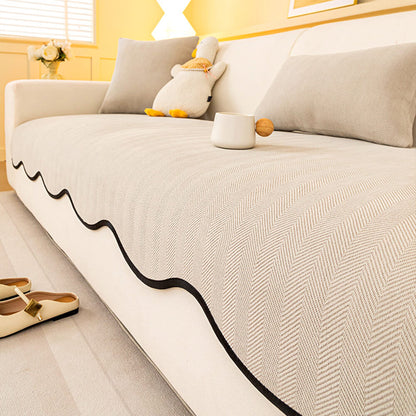 https://cdn.shopify.com/s/files/1/0549/1638/2879/files/FunnyFuzzyMinimalistHerringboneChenilleNon-SlipWavyEdgeCouchCover-9.jpg?v=1747300476